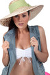 Studio shot of a woman dressed up for the beach