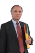 Photo: Mature businessman with a folder Mature businessman with a folder