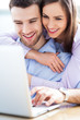 Young couple using laptop
