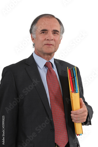 Photo: Mature businessman with a folder Mature businessman with a folder