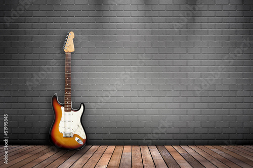 Illustration: Raum mit Holzboden, Ziegelwand und E-Gitarre sunburst Raum mit Holzboden, Ziegelwand und E-Gitarre sunburst