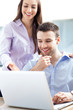 Business people using laptop