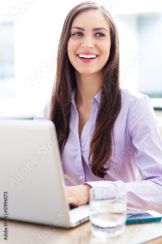 Photo: Businesswoman using laptop Businesswoman using laptop