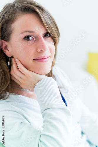 Photo: Real young woman on the couch Real young woman on the couch
