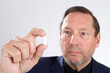 Man Holding Pill Capsule
