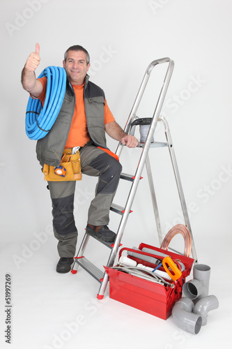 Photo: satisfied craftsman with tools satisfied craftsman with tools