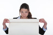 Photo: Woman holding flip-chart paper Woman holding flip-chart paper