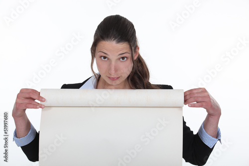 Photo: Woman holding flip-chart paper Woman holding flip-chart paper