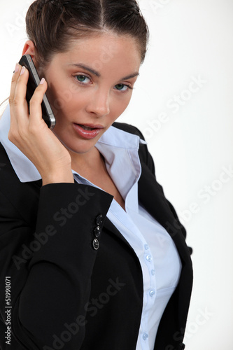 Photo: cute young businesswoman on the phone cute young businesswoman on the phone