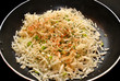 Raw Hasbrown Potatoes with Spices in a Fry Pan