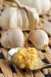 Juicy pressed garlic on spooon