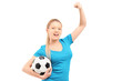 A happy female holding football and cheering