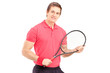 A young man holding a tennis racket