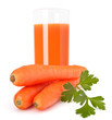 Carrot juice glass and carrot tubers