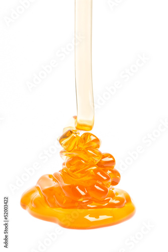 Photo: running honey on white background running honey on white background