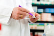 Pharmacist prescription slip in pharmacy