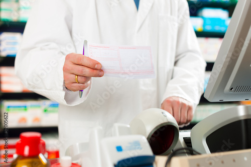 Photo: Pharmacist prescription slip in pharmacy Pharmacist prescription slip in pharmacy