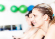 Group of people in the gym doing cardio training