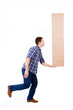 Young man lifting a cardboard box, isolated on white background