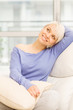 Pretty woman smiling on the sofa