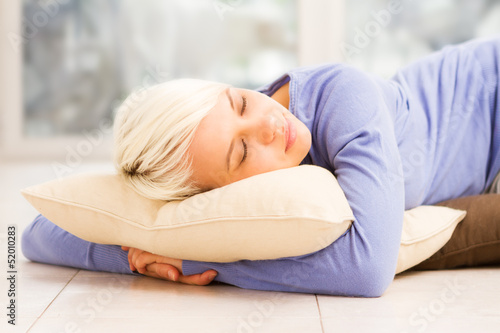 Photo: Pretty woman sleeping on the floor Pretty woman sleeping on the floor