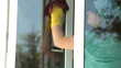Video: Woman cleaning the window at home Woman cleaning the window at home
