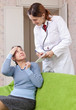  mature woman  complaining to doctor about malaise