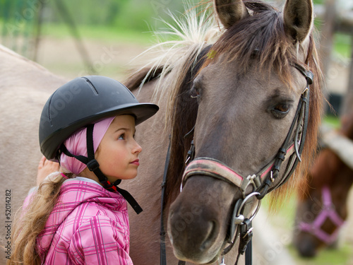 Photo: Horse and lovely equestrian girl Horse and lovely equestrian girl