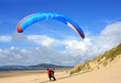 Photo: paraglider landing on beach paraglider landing on beach