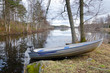 Photo: Small aluminium boat on the lake coast Small aluminium boat on the lake coast