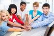 Students showing unity with their hands together