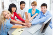 Students showing unity with their hands together