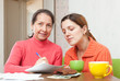 Photo: women fills in s bills at home women fills in s bills at home