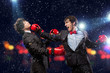 Two young businessman boxing