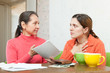 Mature mother berates daughter for bills