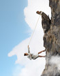 businesswoman climbing mountain