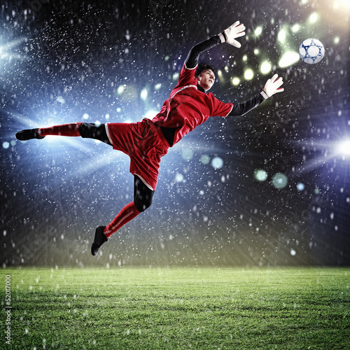 Photo: Goalkeeper catches the ball Goalkeeper catches the ball