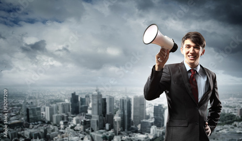 Photo: businessman with megaphone businessman with megaphone