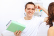 Photo: Young happy couple at hone together s Young happy couple at hone together s