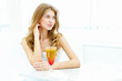 Young woman with a glass of drink