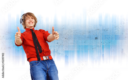 Photo: Happy smiling young man dancing Happy smiling young man dancing