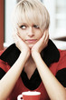 Thoughtful young blond woman
