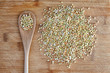 Organic green buckwheat on wooden table