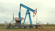 Work of oil pump jack on a oil field.