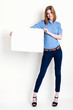 Photo: woman holds out a big blank card woman holds out a big blank card