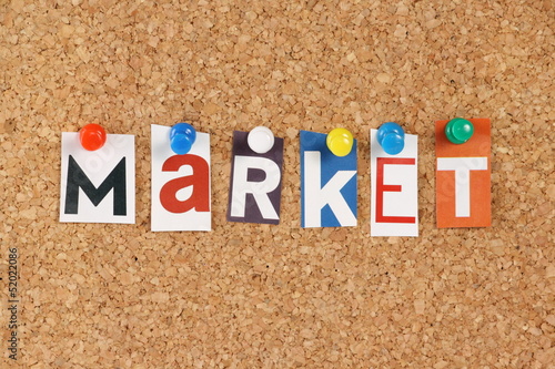Photo: The word Market in cut out magazine letters The word Market in cut out magazine letters