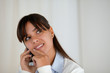 Pensive woman looking up speaking on cellphone