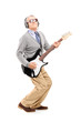 Full length portrait of a mature man playing guitar