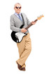 Full length portrait of a mature man with electric guitar leanin