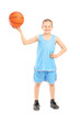 Photo: Full length portrait of a smiling child holding a basketball Full length portrait of a smiling child holding a basketball